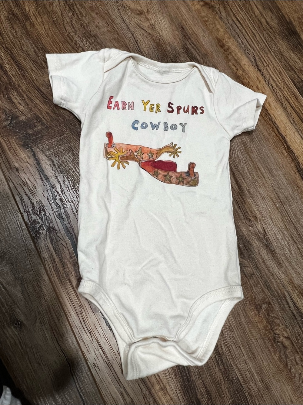 Earn Yer Spurs Cowboy White Baby One-Piece Bodysuit - size 6-12Mo